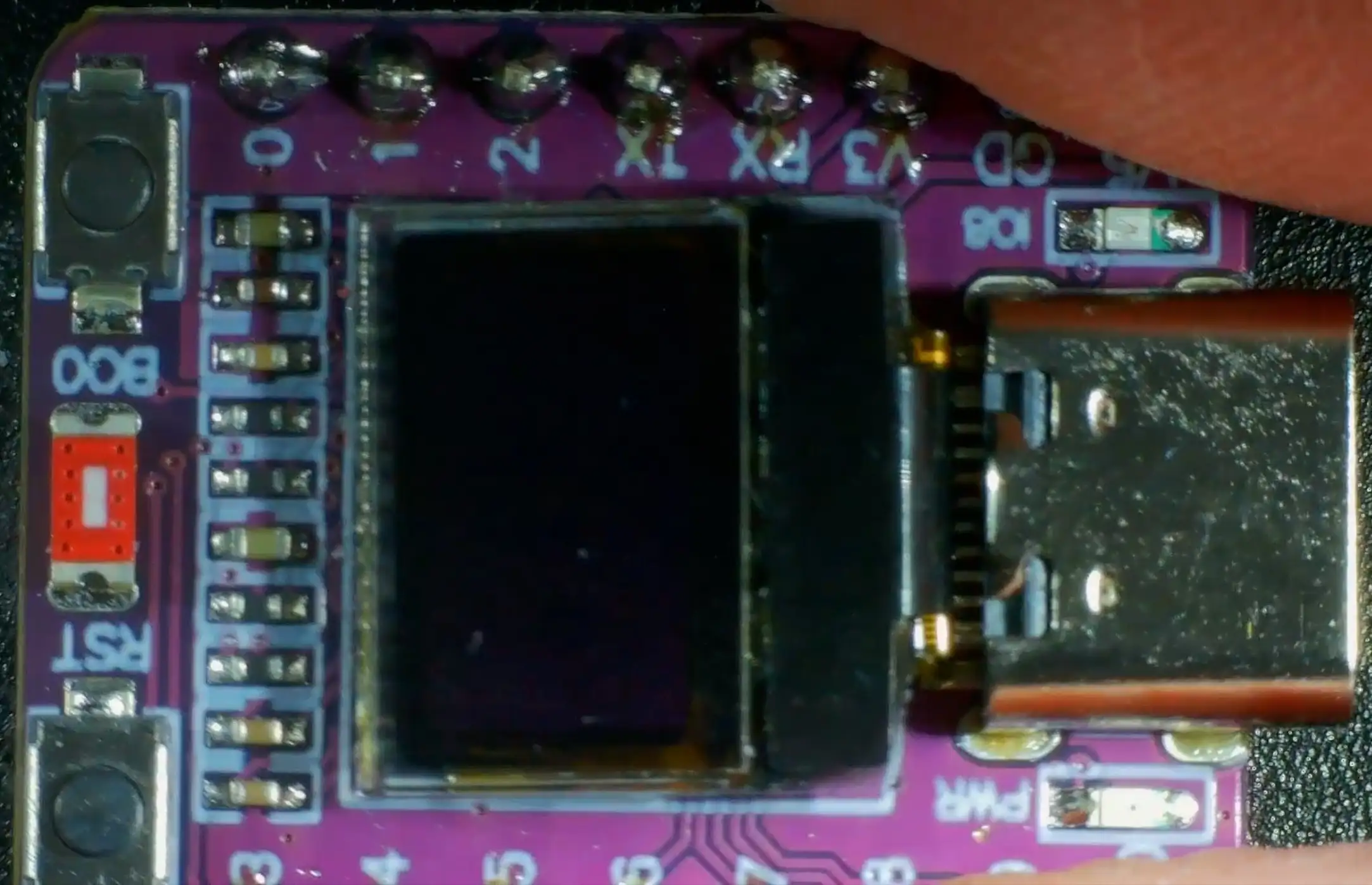 ESP32-C3 board under the microscope